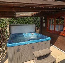 A hot tub in an outdoor area at Tythe Lodge – Hot Tub Retreat in Rural Lincolnshire | Family-Friendly Lodge Near Heckington