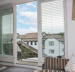 A living room with a view of the outdoors at Estuary View in Kingsbridge