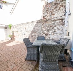 An outdoor area with a table and chairs at 7 Charles Street Dartmouth