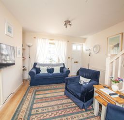 A living room with furniture and a television at 7 Charles Street Dartmouth