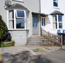 A front entrance with steps and a fence at Crab Cottage Salcombe