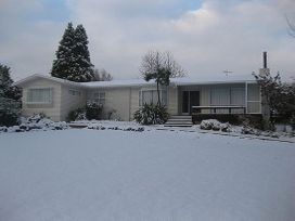 A house covered in snow at Kune Crib - Ohakune Holiday Home near Turoa Ohakune