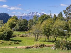 A landscape with mountains and trees at Kune Crib - Ohakune Holiday Home near Turoa, Ohakune