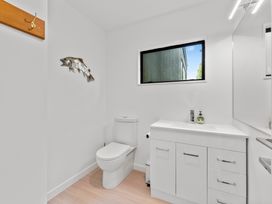 A bathroom with a sink and toilet at Pukawa Haven - Pukawa Bay