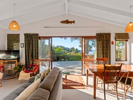 A living room with a view and furniture at Ruatotara - Pukawa Holiday Home Pukawa Bay