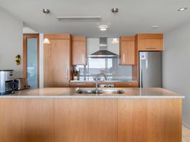 A kitchen with a countertop, sink, and appliances at Taupo Vista - Taupo Apartment Taupo Central