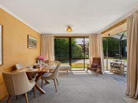 A dining room with a table and chairs at Lakeside Serenity - Wanaka Holiday Home, Wanaka