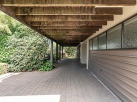 An outdoor area with a paved walkway and a roof structure at Acacia View at No. 3 - Acacia Bay