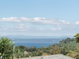 A panoramic view of water and mountains at Acacia View at No. 3 - Acacia Bay