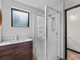 A bathroom with a shower and sink at Acacia View at No. 3 - Acacia Bay
