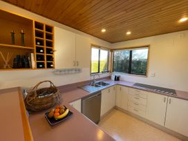 A kitchen with a sink and appliances at Wanaka Tranquility - Wanaka Holiday Home