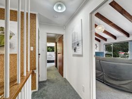 A hallway with artwork and doors at Central Spacious Family House - Paihia