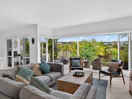 A living room with a sofa and coffee table at Little Pearl of Vista Verano - Mangawhai Village