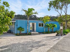 A house with a pathway and plants at Little Pearl of Vista Verano - Mangawhai Village