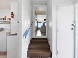 A hallway leading to a living area at Wharewaka Bach - Lake Taupo Holiday Home, Wharewaka