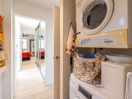 A laundry room with a washing machine and dryer at Moa Magic - Oneroa Holiday Home Oneroa