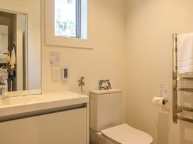 A bathroom with a sink and toilet at Moa Magic - Oneroa Holiday Home Oneroa