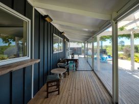 An outdoor room with tables and chairs at Pukawa Country Lodge - Pukawa Bay