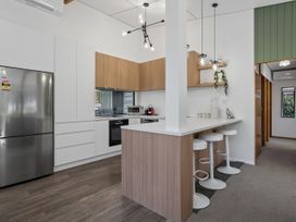 A kitchen with modern appliances at Merioneth Retreat - Arrowtown Holiday Home Abel Tasman National Park