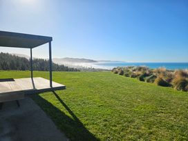 A view of the sea and mountains from a deck at Waimarama Heights - Waimarama