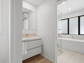 A bathroom with a sink and shower at Rolki House - Hanmer Springs