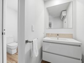 A bathroom with a sink and toilet at Rolki House - Hanmer Springs Holiday Home