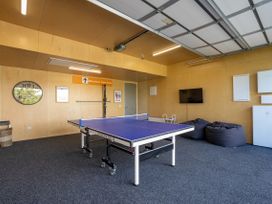 A games room with a table tennis table in Bull Ridge Escape - Wanaka