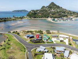 An aerial view of houses and water at Manaia Magic - Tairua Holiday Home in Tairua