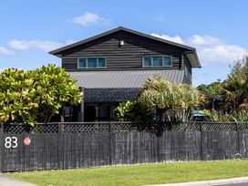 An exterior view of a house with plants at Manaia Magic - Tairua Holiday Home Tairua