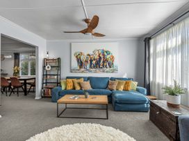 A living room with a sofa and coffee table at Bliss on Barratt - Blenheim Holiday Home