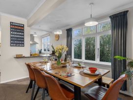 A dining room with a table set for a meal at Bliss on Barratt - Blenheim Holiday Home, Blenheim