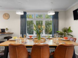 A dining room with a table set for meals at Bliss on Barratt - Blenheim Holiday Home in Blenheim