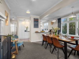 A dining room with a table and chairs at Bliss on Barratt - Blenheim