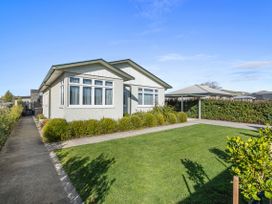 A house with windows and a lawn at Bliss on Barratt - Blenheim