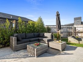 A garden area with an outdoor sofa and table at Bliss on Barratt - Blenheim
