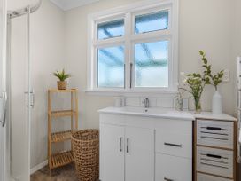 A bathroom with a shower and sink at Bliss on Barratt - Blenheim Holiday Home