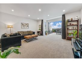 A living room with a sofa and coffee table at Lakeview Luxury - Taupo Holiday Apartment, Taupo Central