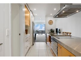 A kitchen with cabinets and appliances at Lakeview Luxury - Taupo Holiday Apartment in Taupo Central