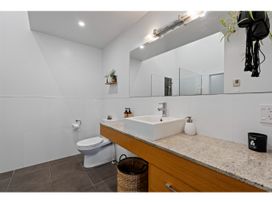 A bathroom with a sink and toilet at Lakeview Luxury - Taupo Holiday Apartment in Taupo Central