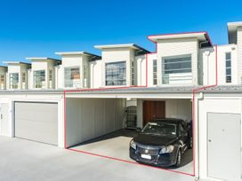A garage with a black car at Lakeview Luxury - Taupo Holiday Apartment Taupo Central