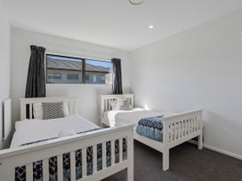 A bedroom with two beds and a window at Casa Central - Wanaka Holiday Home, Wanaka