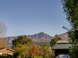 A view of mountains and trees at Frankton Favourite - Queenstown Holiday Home, Queenstown