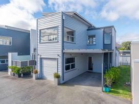 A house with a garage and garden area at Fresh on Fletcher - Lake Taupo