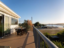 An outdoor area with a table and chairs at Omaha Beach House in Omaha