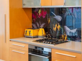 A kitchen with a toaster and kettle at Waimahana 5 - Taupo Holiday Apartment in Waipahihi