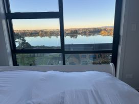 A bedroom with a view of the river at Estuary Views - Riverhead Holiday House, Riverhead