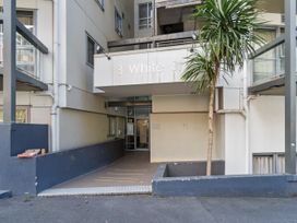 Entrance to a building with a ramp and a small tree at Cityscape on White - Auckland Central Studio in Auckland Central