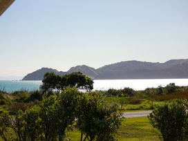 A view of hills and water at Sunset Haven - Mahia Holiday Home Mahia Peninsula