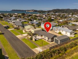 An overview of residential houses with a view of the ocean at Seabreeze Surf House - Whitianga Escape, Whitianga