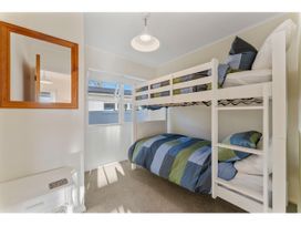 A bunk bed in a bedroom at Waterside Bliss - Taupo Holiday Home Taupo Central